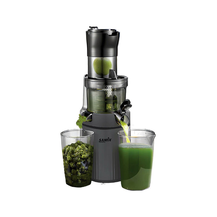 A black SAMIX juicer with a large feed chute and two glasses of juice, one filled and one with whole fruits. The juicer has a visible powerful motor compartment and is displayed with a clear container showing the interior mechanism.