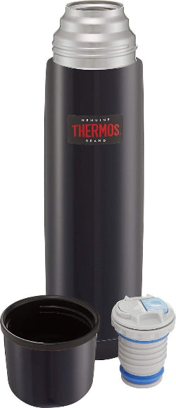 A blue Thermos brand insulated stainless steel flask with its lid and a strainer, displayed against a white background.