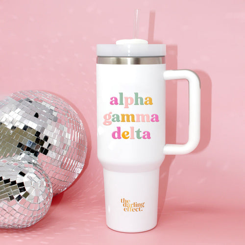 The Darling Effect Alpha Gamma Delta 40 oz Take Me Everywhere White Tumbler features colorful lettering and the brand’s logo.