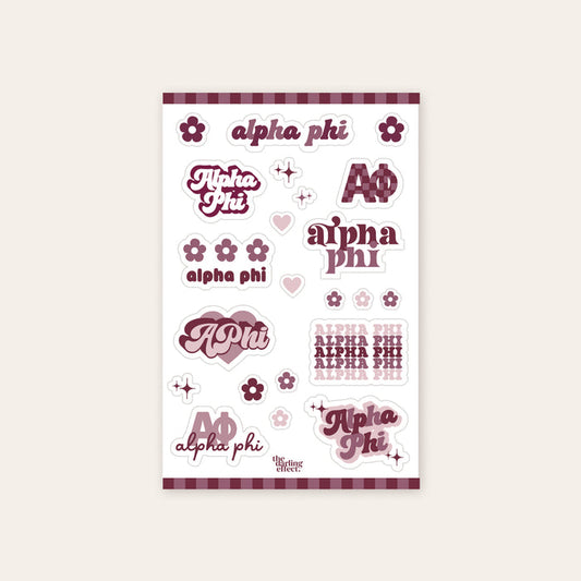 The Darling Effect’s Alpha Phi Sticker Sheet features assorted Alpha Phi texts, maroon and pink flowers, hearts, and borders on white—ideal for showing your sorority spirit and sisterhood pride.