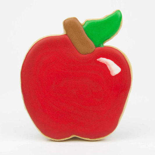 A sugar shortbread cookie decorated to resemble a red apple, complete with a brown stem and a green leaf.