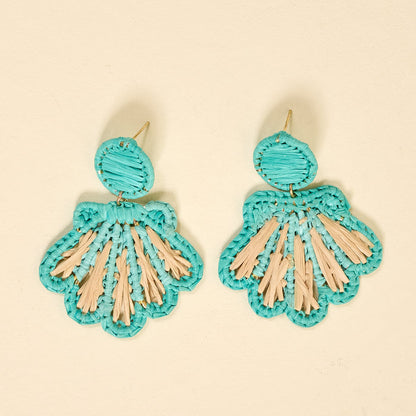 The Darling Effect's Aqua Cabana Breeze Earrings feature turquoise and beige fan-shaped designs with circular tops and scalloped edges—perfect for everyday wear. Shown against a light beige background.
