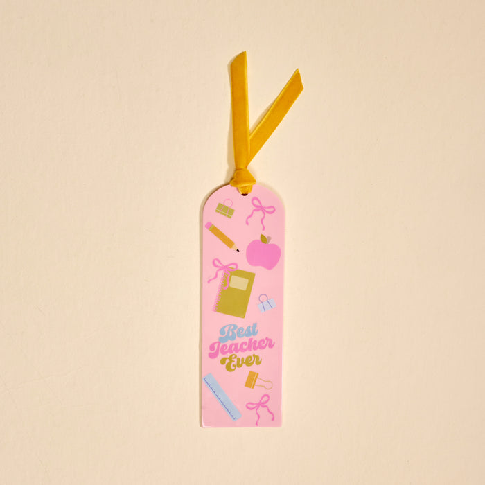 The Best Teacher Ever Acrylic Bookmark features colorful school supply illustrations, an apple, a yellow ribbon, and "Best Teacher Ever" text on a pink acrylic background—perfect as a teacher gift or for book lovers.