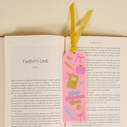 The Best Teacher Ever Acrylic Bookmark makes a great gift for book lovers. This pink bookmark features school-themed illustrations, "Best Teacher Ever" text, and a yellow ribbon for easy use.