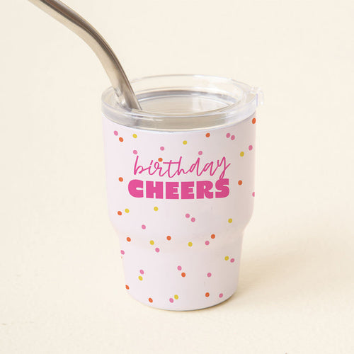 Celebrate in style with the-darling-effect's Birthday Cheers 2 oz Tiny Tumbler, featuring colorful polka dots, a metal straw, and playful pink "birthday CHEERS" lettering—ideal for sipping your favorite cold drinks!.