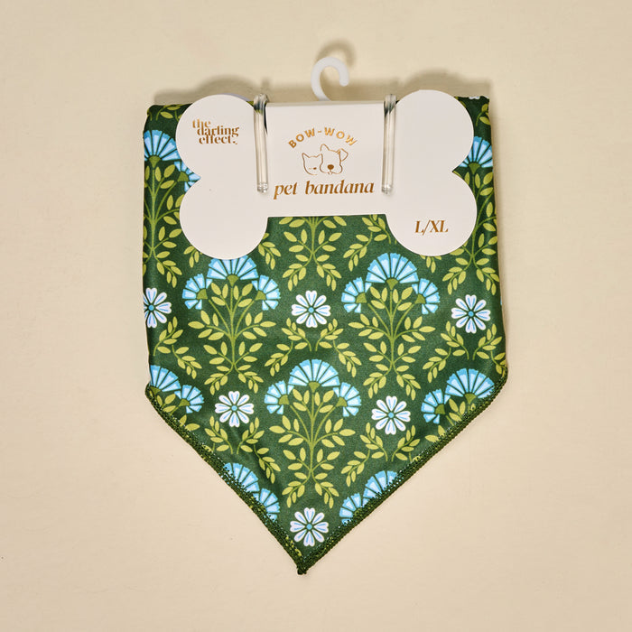 The Darling Effect's Bow-Wow Pet Bandana-Everbloom Forest Green features a blue and white floral pattern in L/XL cotton, packaged and ready for pets. Colors may vary due to lighting effects.
