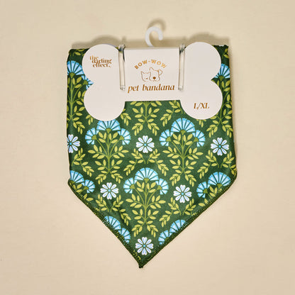 The Darling Effect's Bow-Wow Pet Bandana-Everbloom Forest Green features a blue and white floral pattern in L/XL cotton, packaged and ready for pets. Colors may vary due to lighting effects.