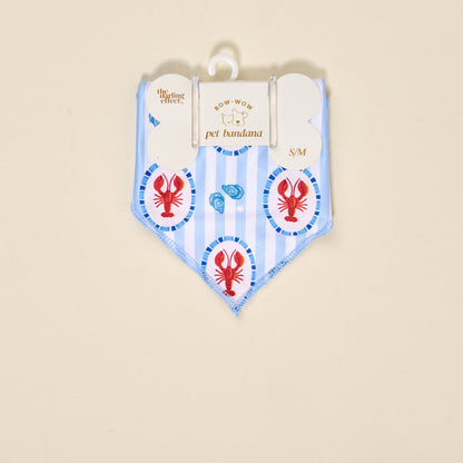 The Darling Effect Bow-Wow Pet Bandana-Harbor House in blue and white stripes with red lobster and blue shell accents is a charming S/M accessory, perfect for adding pet fashion to your pup. Comes in Bow-Wow packaging.