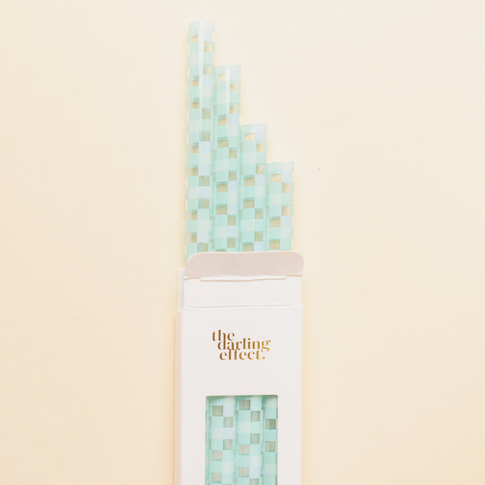 The Darling Effect Check Blue 40 oz Tumbler Straw Set features eco-friendly, reusable pastel blue and white checkered straws in a box with the gold logo—perfect for your tumbler.