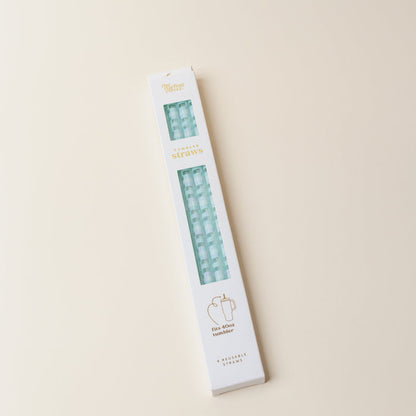 The Darling Effect Check Blue 40 oz Tumbler Straw Set comes in eco-friendly packaging with a window showing light blue striped reusable straws and gold and green text. Includes a simple cup illustration—ideal for 40 oz tumblers.