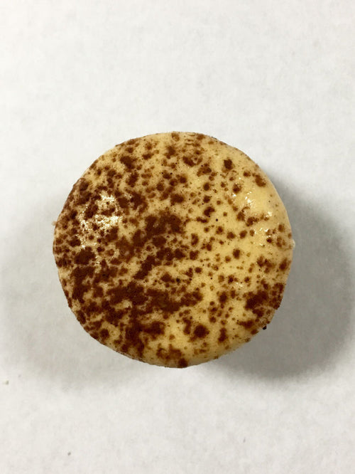 Coffee Mocha Macaron with a dark Ivory and dusted cocoa powder shell