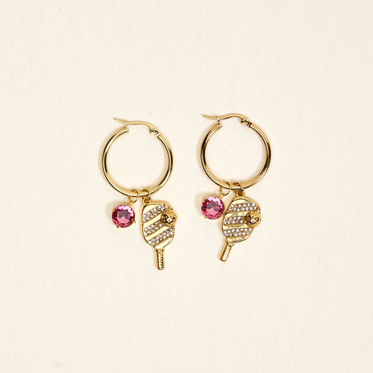 The Darling Effect's Dinking Around Signature Hoop Earrings feature popsicle-shaped charms with white rhinestones and a pink gem—perfect for adding a sparkling touch to your everyday look.