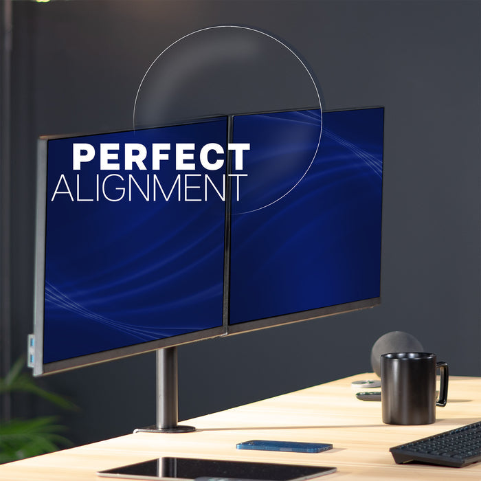 Two computer monitors on a desk with 'Perfect Alignment' text on the screen.