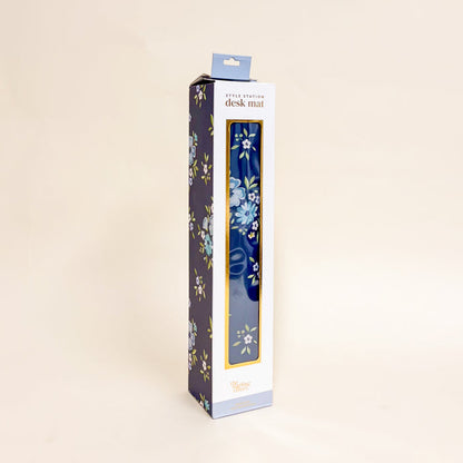 The-darling-effect Endless Daydream Navy Style Station Desk Mat features a non-slip surface with a light blue floral pattern and comes in a tall box with floral design, clear window, and product branding—perfect for brightening any workspace.