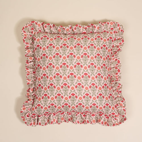 The Darling Effect’s Everbloom Dusty Rose Scalloped Square Throw Pillow features green stems and red-orange flowers with charming ruffled edges.