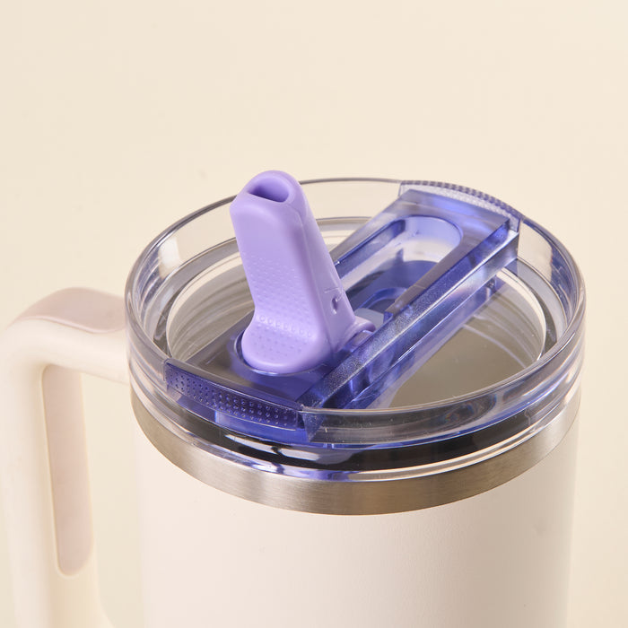 Close-up of the-darling-effect Periwinkle 40 oz Lifestyle Flip Straw Lid: a white insulated lid with a purple pull-tab, leak-resistant clear plastic cover, silver rim—ideal for easy hydration on the go.
