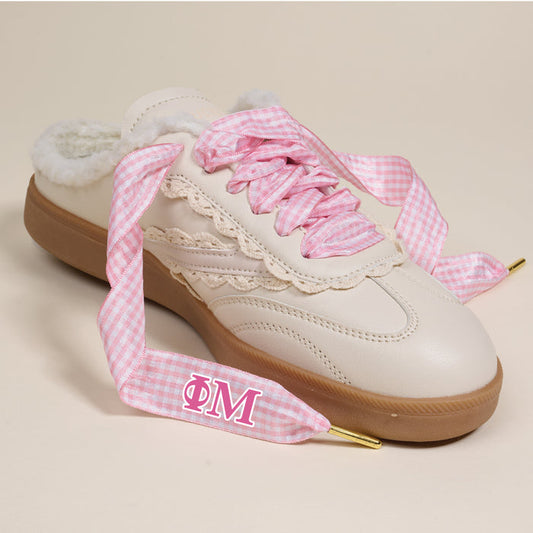 Phi Mu Step It Up Shoelaces by The Darling Effect feature pink and white gingham, gold-tipped ends, and display the Greek letters ΦΜ (Phi Mu) in pink—ideal sorority accessories to elevate your style.