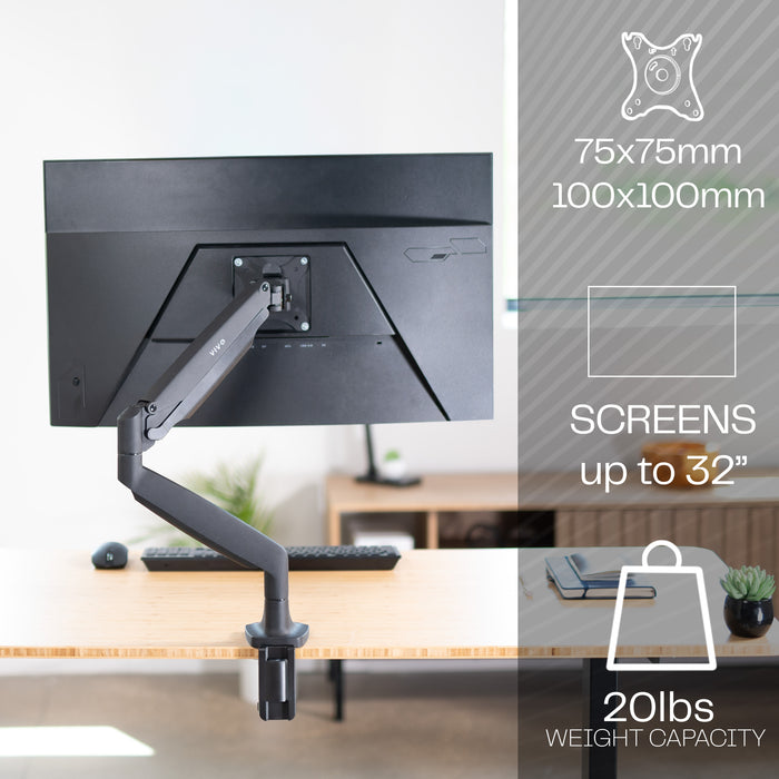 Pneumatic Arm Single 13” to 32" Monitor Desk Mount on a desk with screen size and weight capacity details.