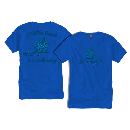 Bright blue cotton t-shirt featuring a teal embroidered design of a yarn ball with the word ’weezer’ and the phrase ’hold this thread or i walk away.’