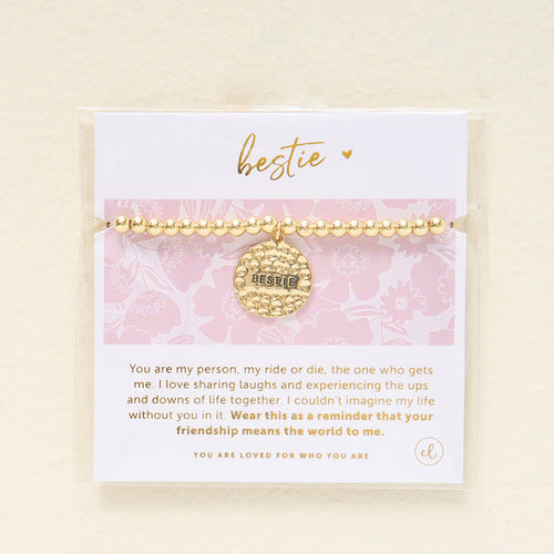 The Darling Effect Sentiment Beaded Charm Bracelet features gold beads, a hammered Bestie charm, and comes on a pink floral card with a friendship message—making it the perfect gift for your closest friend.