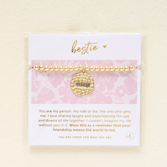 The Darling Effect Sentiment Beaded Charm Bracelet features gold beads, a hammered Bestie charm, and comes on a pink floral card with a friendship message—making it the perfect gift for your closest friend.