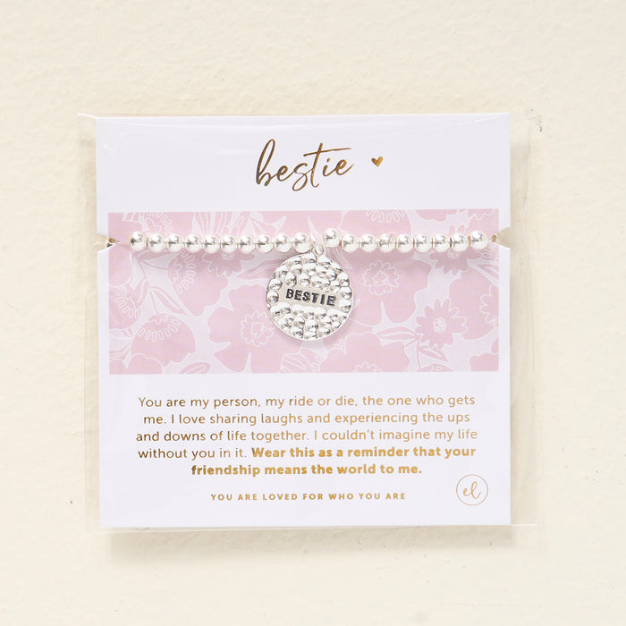 The Darling Effect Sentiment Beaded Charm Bracelet features a BESTIE charm and comes on a card with a heartfelt friendship message and pink floral design, making it the perfect sentimental gift for your best friend.