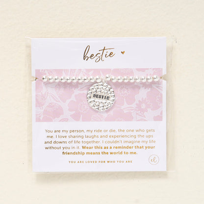 The Darling Effect Sentiment Beaded Charm Bracelet features a BESTIE charm and comes on a card with a heartfelt friendship message and pink floral design, making it the perfect sentimental gift for your best friend.