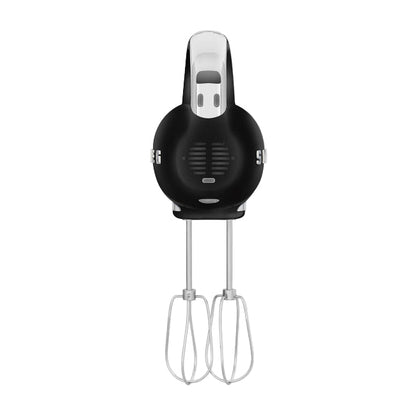 Black hand mixer with attachments on a white background