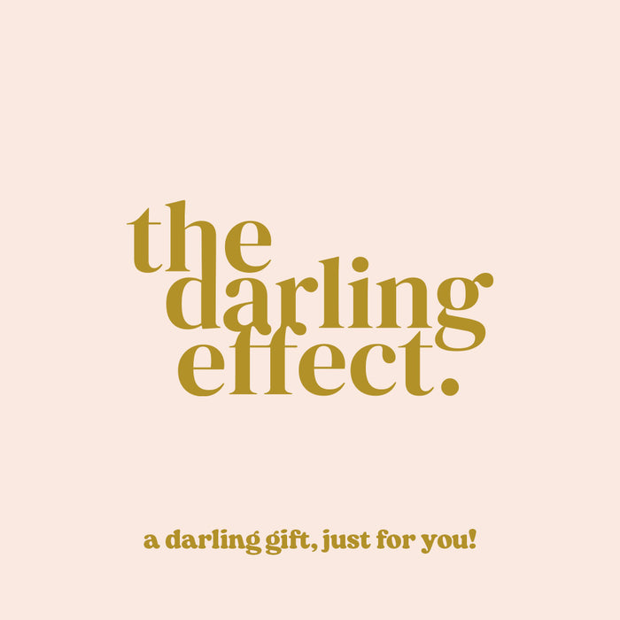 Text in gold font on a light beige background reads: The Darling Effect. Below, smaller text says, The Darling Effect E-Gift Card, just for you!.