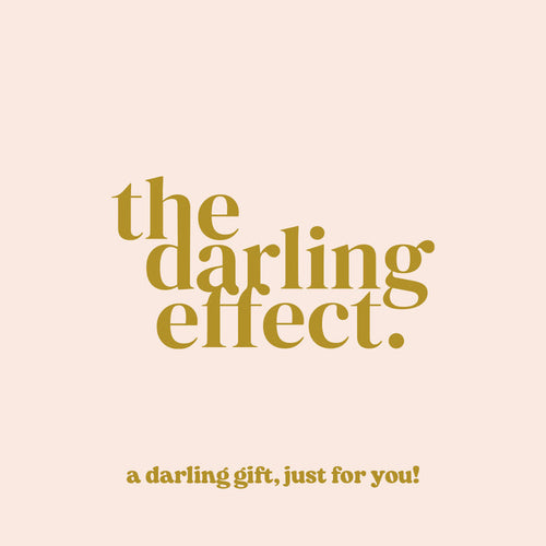Text in gold font on a light beige background reads: The Darling Effect. Below, smaller text says, The Darling Effect E-Gift Card, just for you!.