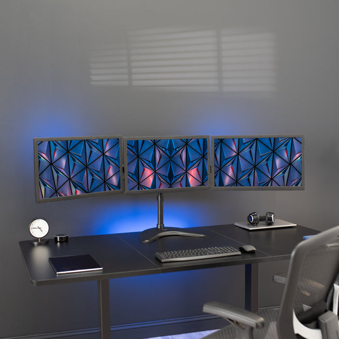 Sturdy height adjustable triple monitor desk stand.
