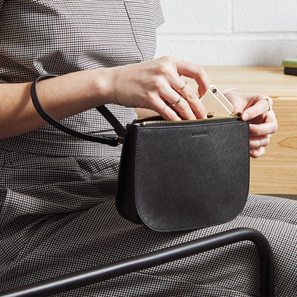 On model on the move with backpack - The Waverley 2 - Saffiano Leather - Black / Gold / Grey - Crossbody - Lo & Sons