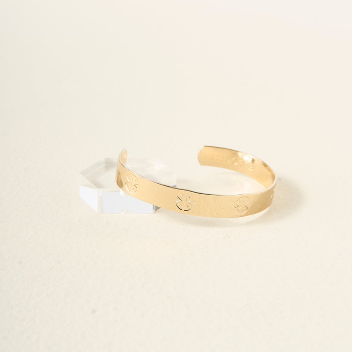 The Darling Effect's "You Are Strong" Cuff Bracelet features engraved geometric patterns, an inner "You Are Strong" inscription, and an adjustable fit—blending elegance with personal inspiration.