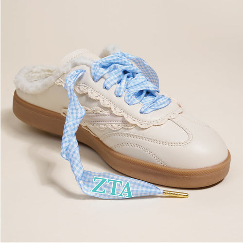 The Darling Effect's Zeta Tau Alpha Step It Up Shoelaces feature blue and white gingham laces, fuzzy lining, a lace detail, and turquoise-and-white ZTA tips—perfect for gifting your favorite sorority member.