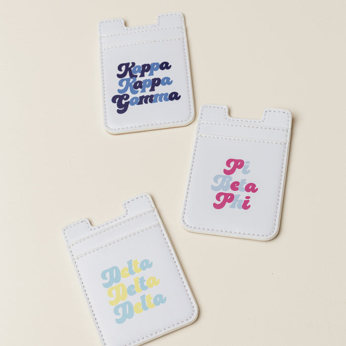 The Darling Effect Zeta Tau Alpha Stick-On Phone Wallet in white with colorful text is a perfect sorority gift for any ZTA member.