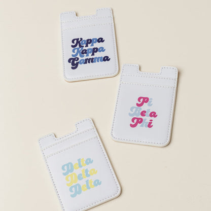The Darling Effect Zeta Tau Alpha Stick-On Phone Wallet in white with colorful text is a perfect sorority gift for any ZTA member.